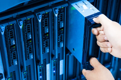 A Dell blade server is being removed from a server rack